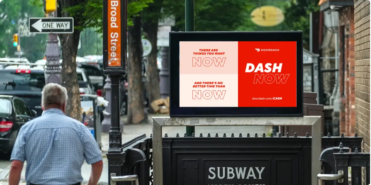 DOOH screen above a subway station entrance on Broad Street.